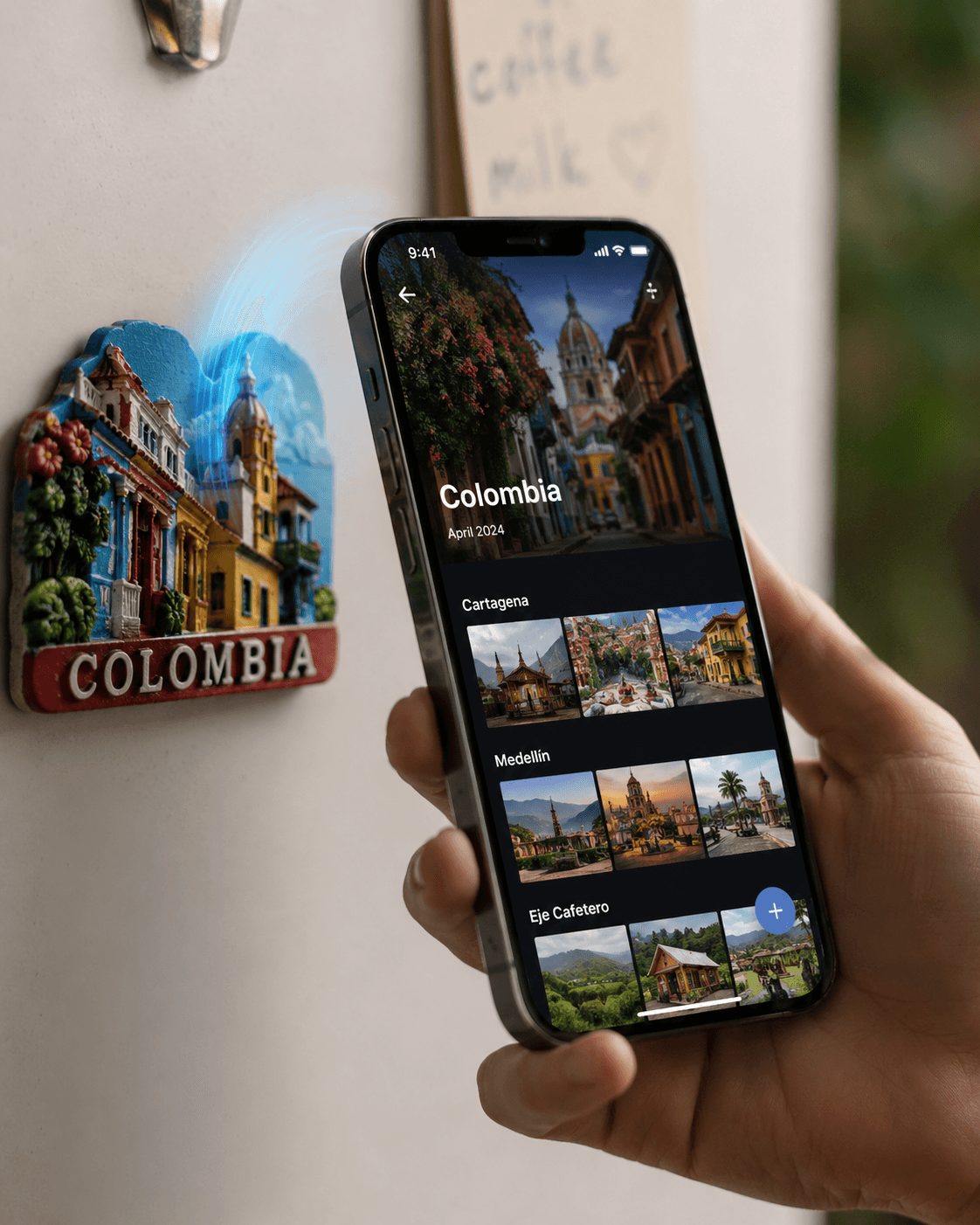 Travel magnet on fridge with phone showing digital album